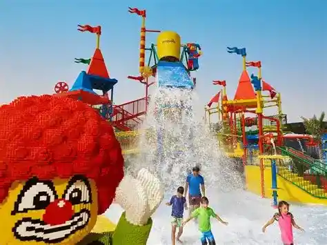 Children enjoying LEGO® themed water slides and Build-A-Raft River at LEGOLAND Water Park Dubai, perfect for families and kids aged 2–12