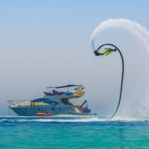 Fly boarding Dubai 30 minutes experience with a rider flying above the water at Jumeirah Beach during an extreme water sports activity