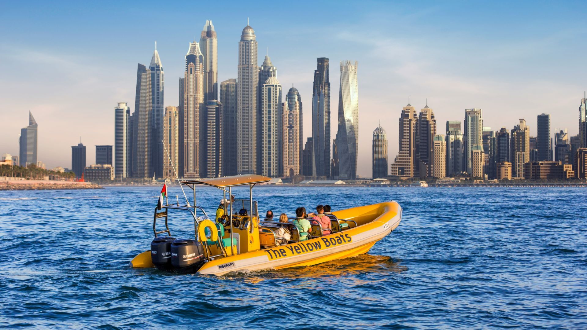 Yellow Boats 99 Minutes Premium Tour cruising along Dubai coastline with Atlantis The Palm, Palm Jumeirah, and Dubai skyline views