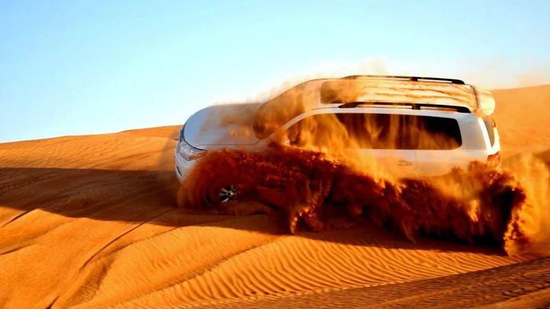 Desert Safari from Ajman Dune Bashing, henna painting and premium setting and more