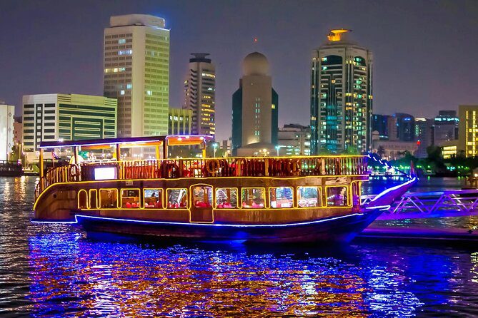 Dubai Marina dhow cruise dinner with international buffet, Tanoura dance performance, and panoramic night views of Marina waterfront