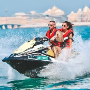 Jet Ski Adventure Dubai with riders enjoying a guided Jet Ski ride along Dubai’s coastline near Jumeirah Beach with skyline views