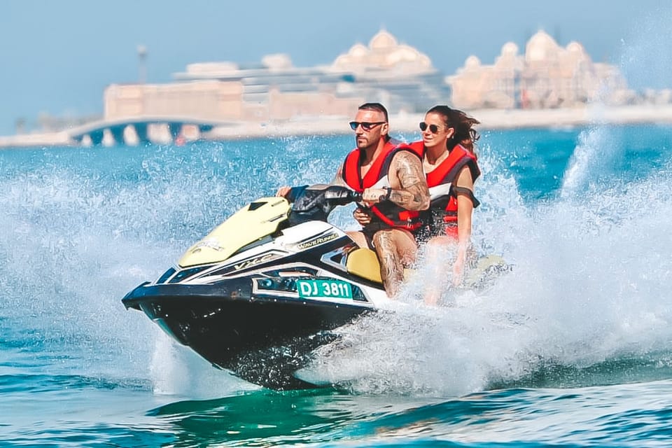 Jet Ski Adventure Dubai with riders enjoying a guided Jet Ski ride along Dubai’s coastline near Jumeirah Beach with skyline views