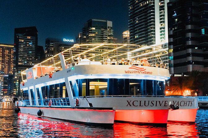 Luxury dinner cruise in Dubai Marina featuring illuminated skyscrapers, romantic ambiance, and premium dining on the water